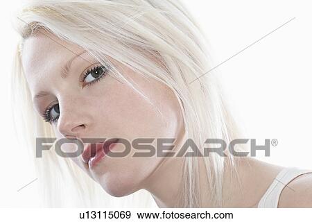 Stock Photo - Studio portrait of young woman close-up. Fotosearch