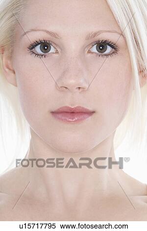 Stock Photography - Studio portrait of young woman close-up. Fotosearch