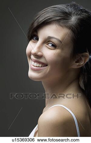 Stock Photograph - Studio portrait of young woman. Fotosearch