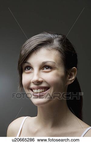 Stock Photograph - Studio portrait of young woman. Fotosearch