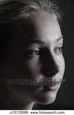 Stock Photo - Studio shot of teenage (16-17) girl. Fotosearch