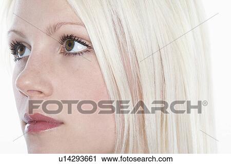 Studio shot of young woman close-up View Large Photo Image Stock Image - Studio shot of young woman close-up. Fotosearch