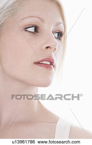 Studio shot of young woman close-up View Large Photo Image Stock Photograph - Studio shot of young woman close-up. Fotosearch