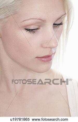 Studio shot of young woman close-up View Large Photo Image Stock Photography - Studio shot of young woman close-up. Fotosearch