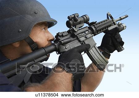 Swat officer aiming gun View Large Photo Image Picture - Swat officer aiming gun. Fotosearch