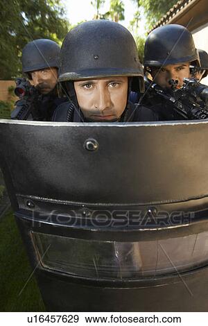 Swat officers behind shield View Large Photo Image Stock Photo - Swat officers behind shield. Fotosearch