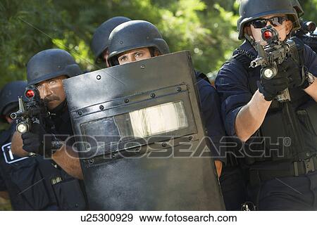 Swat officers with gun and shield View Large Photo Image Stock Photo - Swat officers with gun and shield. Fotosearch