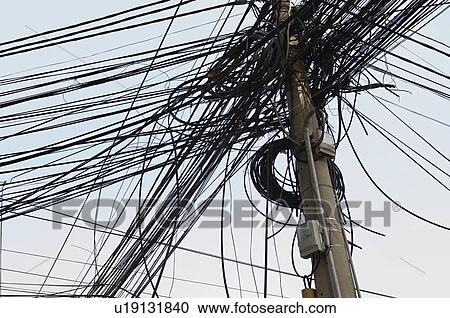 Stock Image - Tangle of Electrical Wires on Power Pole. Fotosearch