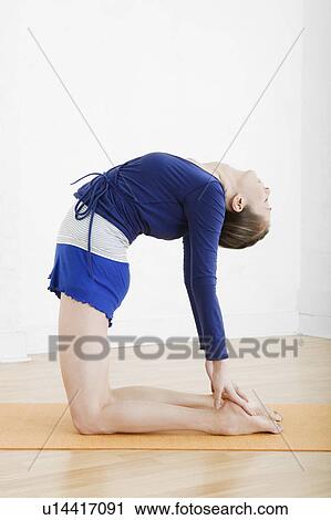 Teenage girl (16-17) exercising View Large Photo Image Stock Image - Teenage girl (16-17) exercising. Fotosearch