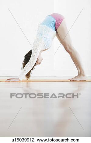 Teenage girl (16-17) exercising View Large Photo Image Stock Image - Teenage girl (16-17) exercising. Fotosearch