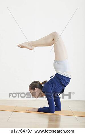 Teenage girl (16-17) exercising View Large Photo Image Stock Photo - Teenage girl (16-17) exercising. Fotosearch