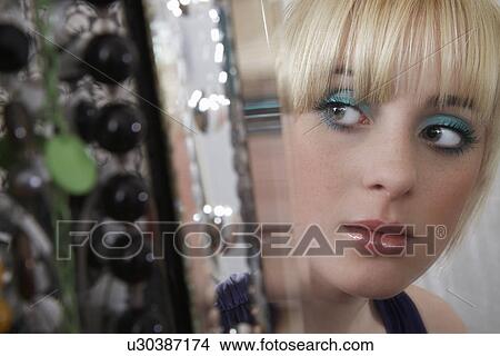 Teenage girl (16-17) looking in mirror View Large Photo Image Picture - Teenage girl (16-17) looking in mirror. Fotosearch
