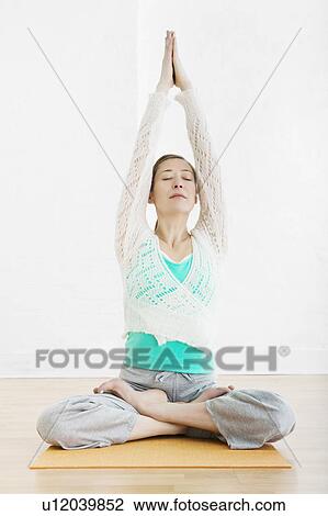 Teenage girl (16-17) performing yoga View Large Photo Image Stock Image - Teenage girl (16-17) performing yoga. Fotosearch