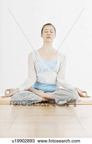 Teenage girl (16-17) performing yoga View Large Photo Image Stock Image - Teenage girl (16-17) performing yoga. Fotosearch