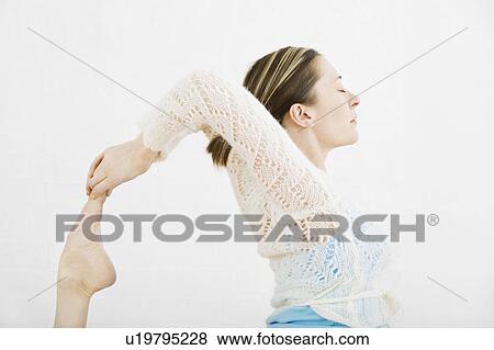 Teenage girl (16-17) performing yoga View Large Photo Image Stock Photo - Teenage girl (16-17) performing yoga. Fotosearch