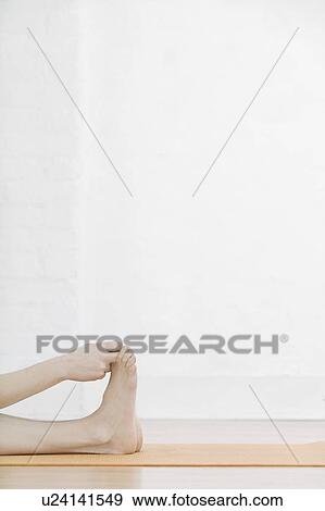 Teenage girl (16-17) stretching leg low section View Large Photo Image Stock Photo - Teenage girl (16-17) stretching leg low section. Fotosearch
