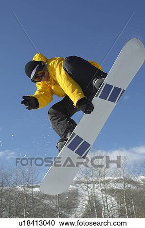 Teenage snowboarder jumping View Large Photo Image Stock Image - Teenage snowboarder jumping. Fotosearch