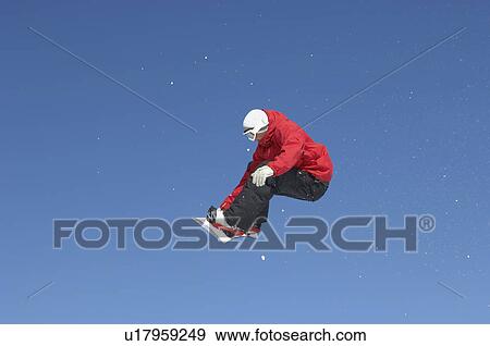 Teenage snowboarder jumping View Large Photo Image Stock Photo - Teenage snowboarder jumping. Fotosearch