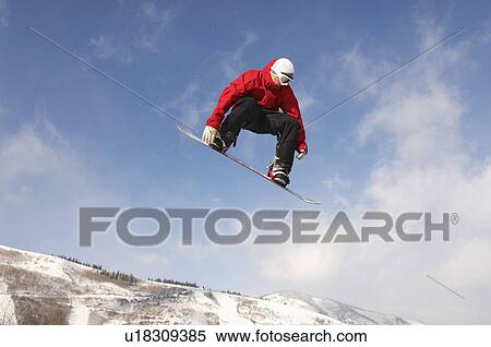 Teenage snowboarder jumping View Large Photo Image Stock Photography - Teenage snowboarder jumping. Fotosearch