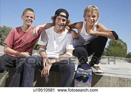 Three teenage boys (16-17) with skateboards at skate park portrait View Large Photo Image Stock Image - Three teenage boys (16-17) with skateboards at skate park portrait. Fotosearch