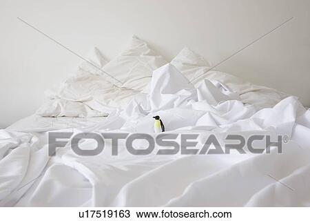 Toy penguin on bed View Large Photo Image Stock Image - Toy penguin on bed. Fotosearch
