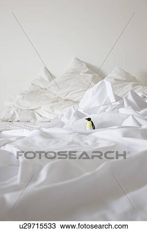 Toy penguin on bed View Large Photo Image Stock Image - Toy penguin on bed. Fotosearch