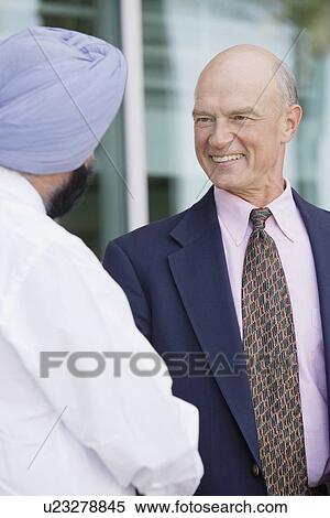 Two Businessmen Shaking Hands Rear View View Large Photo Image Stock Photography - Two Businessmen Shaking Hands Rear View. Fotosearch