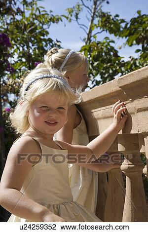 Stock Image - Two girls on balcony. Fotosearch