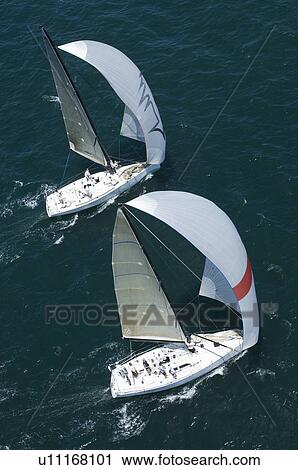 Stock Image - Two yachts compete in team sailing event California. Fotosearch
