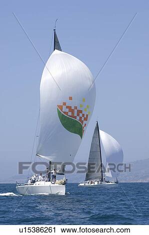 Stock Image - Two yachts compete in team sailing event California. Fotosearch