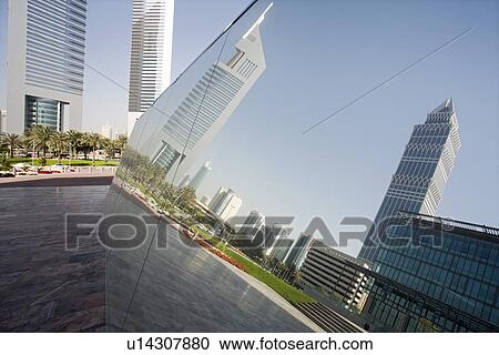 UAE Dubai reflection in a mirrored piece of artwork on display at the Dubai International Financial Centre View Large Photo Image Stock Image - UAE Dubai reflection in a mirrored piece of artwork on display at the Dubai International Financial Centre. Fotosearch