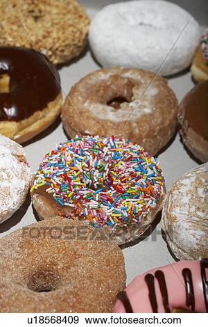 Stock Photo - Variety of doughnuts in box. Fotosearch