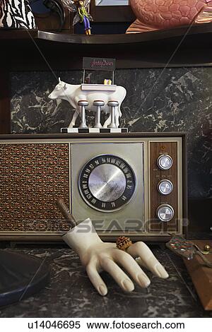Stock Photography - Vintage Radio and Mannequin Hand in Second Hand Store. Fotosearch