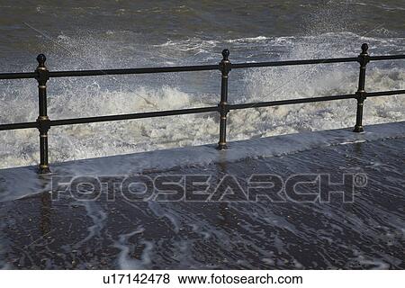 Water crashing over rail View Large Photo Image Stock Photo - Water crashing over rail. Fotosearch