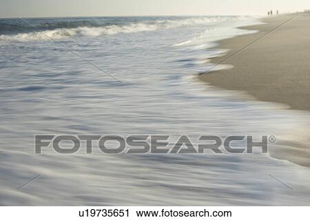 Wave washing on shore blurred motion View Large Photo Image Stock Image - Wave washing on shore blurred motion. Fotosearch