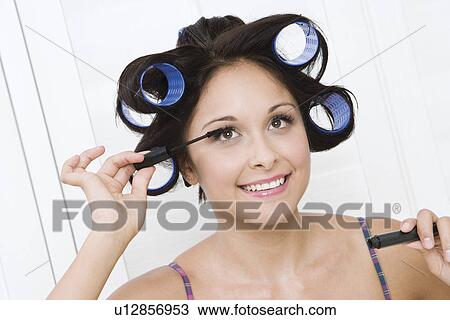 Woman applying mascara View Large Photo Image Stock Image - Woman applying mascara. Fotosearch