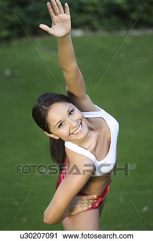 Woman exercising in park View Large Photo Image Stock Image - Woman exercising in park. Fotosearch