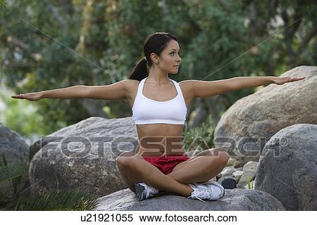 Stock Photography - Woman exercising in park. Fotosearch