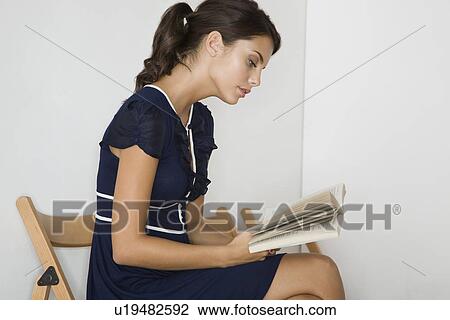 Stock Image - Woman reading. Fotosearch