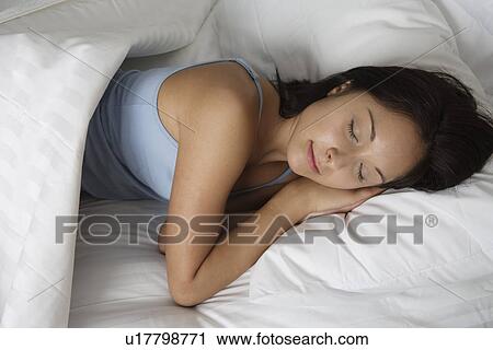 Stock Image - Woman sleeping. Fotosearch