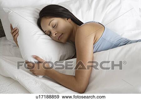 Stock Photo - Woman sleeping. Fotosearch