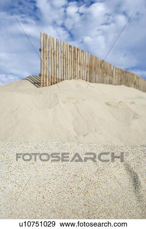 Wooden fence on sand dune View Large Photo Image Stock Photo - Wooden fence on sand dune. Fotosearch
