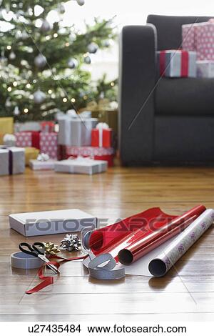 Picture - Wrapping paper and accessories on floor. Fotosearch