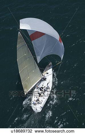Stock Image - Yacht competes in team sailing event California. Fotosearch