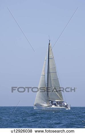 Stock Photo - Yacht competes in team sailing event California. Fotosearch