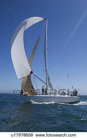 Stock Photo - Yacht competes in team sailing event California. Fotosearch