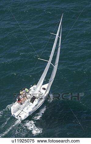 Yacht competes in team sailing event California aerial view View Large Photo Image Stock Photography - Yacht competes in team sailing event California aerial view. Fotosearch