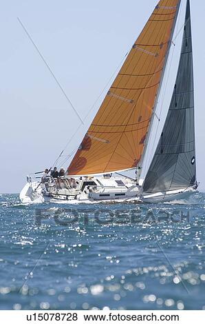 Yacht with yellow sail competes in team sailing event California View Large Photo Image Stock Photo - Yacht with yellow sail competes in team sailing event California. Fotosearch