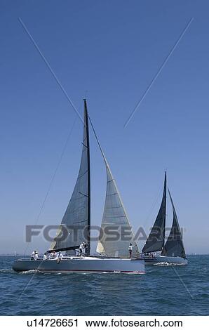 Stock Image - Yachts compete in team sailing event California. Fotosearch