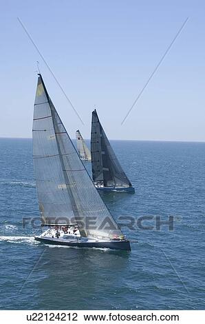 Stock Image - Yachts compete in team sailing event California. Fotosearch